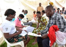 Healh workers receive members of the public for TB screening during the commemoration 