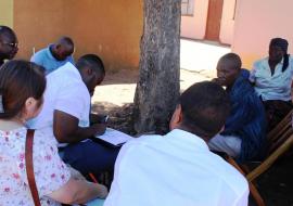 Participants interviewing a community member who once suffered from malaria Participants interviewing a community member who once suffered from malaria