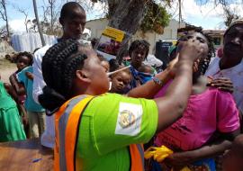 Health worker vaccinating woman