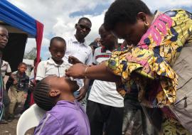 A child receives the vaccine on May 27, 2019