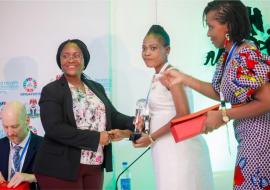 Ms. Oninye Iromba receiving an award at the NMSAP launch Ms. Oninye Iromba receiving an award at the NMSAP launch