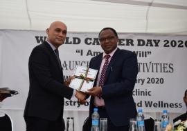 Minister of Health and Wellness, Dr Hon. K. K. S. Jagutpal handing over a copy of the National Cancer Registry Report 2018 to Dr L. Musango, WHO Representative in Mauritius