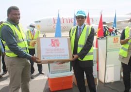 WHO Rep. Dr. Desta Tiruneh handing over donated medical supplies to Hon. Dr. Ahmadou Samateh