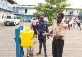 Security guards deployed at WHO office in Juba, practices hand washing as a recommended measure to prevent the spread of #COVID-19