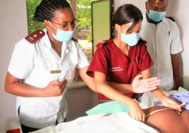 Health care workers providing care to a pregnant woman 