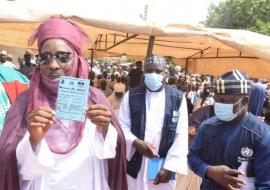 The Emir of Duste, His Royal Highness Dr Nuhu Muhammadu Sanusi showing off his vaccination card after receiving OCV during the flag-off
