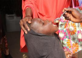 An eligible child being administered with Seasonal Malaria drug. Photo_credit_Kingsley_WHO