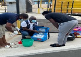 WHO Polio Consultant, Mr Constant Dedo training a newly recruited officer on environmental sample collection procedures at a sample collection site, Gammams Water Care, Windhoek WHO Polio Consultant, Mr Constant Dedo training a newly recruited officer on environmental sample collection procedures at a sample collection site, Gammams Water Care, Windhoek