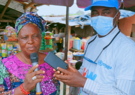 The head of Akindeko market (left) speaking on the importance of vaccination.png