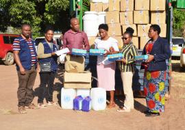 WHO team handing over items and supplies to the Katavi Regional Health Management Team