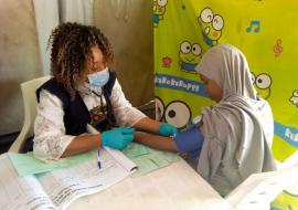 Mrs. Mercy Ameh checking the blood pressure of a pregnant woman in hard-to-reach area