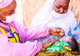  Child being vaccinated with oral polio vaccine