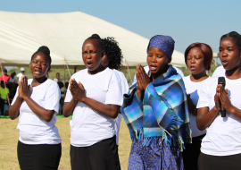 An improvised song about ending malaria in Botswana is performed by a choir during the World Malaria Day commemoration in Maun