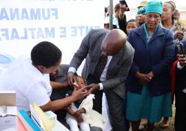 WHO Lesotho Country Representative, Dr Richard Banda vaccinating a baby during the official launch of the African Vaccination Week in Lesotho