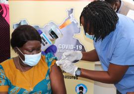 A health worker being vaccinated against COVID-19