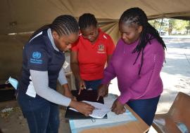 Josephine Poniso and colleagues in the triage tent at the entrance of the hospital