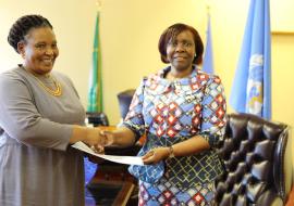 Minister of Foreign Affairs and International Relations Honorable Thuli Dhladhla receiving a letter of credence from the WHO Representative to Eswatini Dr Susan Tembo