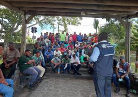 A WHO expert conducting an education session for a vector control team. A WHO expert conducting an education session for a vector control team.