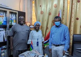 Dr. Jane Maina (center) with the Honorable Minister of Health, Dr. Ahmadou L. Samateh (right)