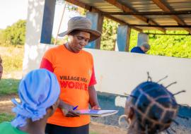 Mary providing education to women before screening Mary Mungwere