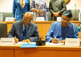 Lt. Gen. Danjuma and Dr Kazadi Mulombo (WR Country Representative) during the signing of the partnership