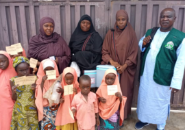 Children showing their cards after OCV vaccination in Zamfara State