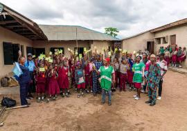 MR campaign; children displayimg their vaccination cards