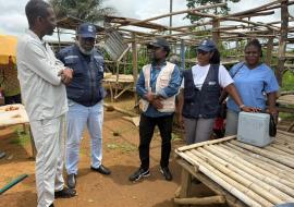 WHO Representative Dr Olushayo Olu visits a yellow fever vaccination site in Grand Cape Mount County.
