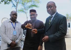 WHO Country Representative handing over motorbike keys to the Deputy Minister of Health