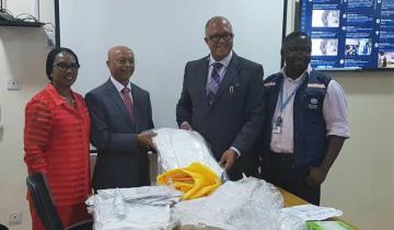 WHO country Representative Dr Wondimagegnehu Alemu hands over personal protective equipment to Chief Executive Officer of the Nigeria Centre for Disease Control Dr Chikwe Ihekweazu