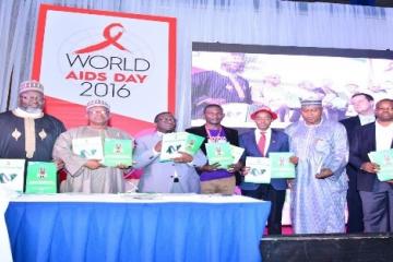 From R-L, Barr Adebayo Shittu; Minister for Communication, Dr Osagie Enahire, Minister of State for Health, Minister for Health, representative of the PLHIV, Dr Sani Aliyu; DG NACA and other dignitaries at the event