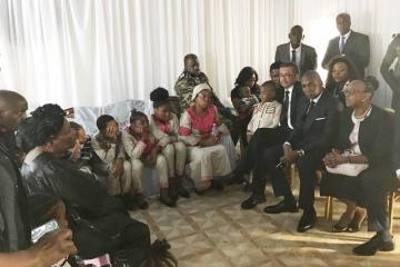 Dr Tedros and Dr Moeti conversing with the family