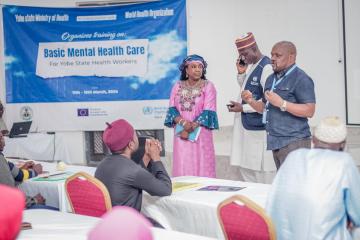 The WHO Officer-in-Charge (Dr. Pekezou Aurelien) and Interim Emergency Manager NEN (Dr. Kumshida Balami) encourage the participants during the mental health training. ©Kingsley Igwebuike/WHO