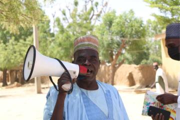 a town crier, Mr Usman calling on parent to get their children to the vaccination post to recieve the MenFive vaccine Photo credit â€“ Ayodamola Owoseye