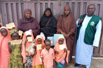 Children showing their cards after OCV vaccination in Zamfara State
