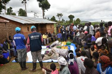 WHO Staff members conducting a community engagement activity during the Marburg Virus Disease outbreak
