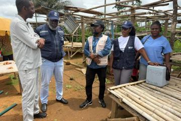 WHO Representative Dr Olushayo Olu visits a yellow fever vaccination site in Grand Cape Mount County.