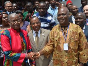 Shaking hands: NTDs Ambassador Evelyne Kandakai (in red) and Hon Johnson Toe Chea (right), Dr Francis Kateh (middle) 
