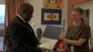 The Assistant Minister receiving the HINARI License Certificate