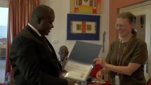 The Assistant Minister receiving the HINARI License Certificate