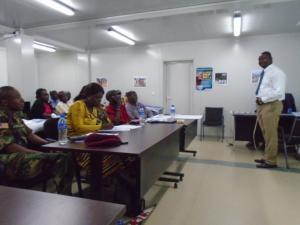 Hon Tolbert Nyenswah Deputy Minister of Health Disease Surveillance and Epidemic Control addressing participants