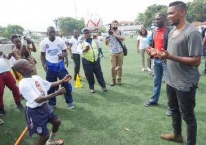 Samuel Eto’o training with some of the children at the Football academy in Freetown