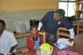 WHO Ethiopia Neglected NTD Coordinator Dr Abate Mulugeta overseeing the deworming in a school in Addis Ababa