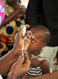 Young Gambian child waiting to be immunized with MenAfriVac