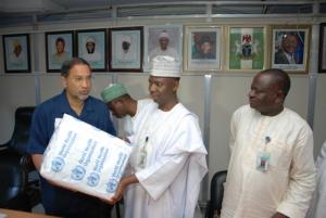 Dr. Rui Gama Vaz handing over the training DVDs to Dr. Ado Mohammed