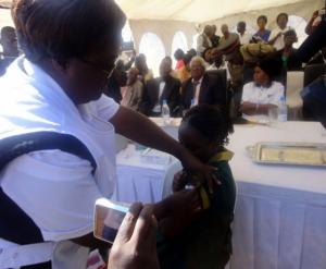 A grade four pupil getting vaccinated