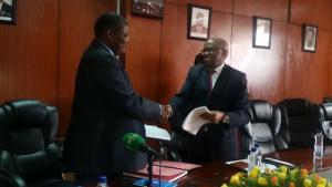 Dr. Jacob Mufunda, WHO Representative (left ) and Mr. Damoni Kitabire, Resident Representative, African Development Bank at the signing ceremony