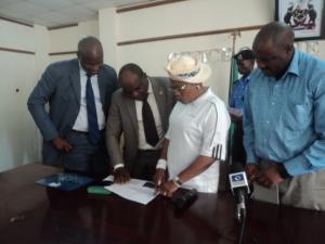 Deputy Governor of Osun State, reviewing the list of LGAs with un-immunized children with Dr Famiyesin WHO SW Zonal Coordinator, PS MOH and Mr Charles Korir.