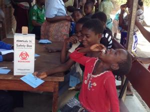A young child taking in the Oral Cholera Vaccine during the first dose campaign in Chikwawa