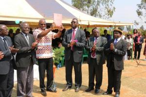 The Minister of Health, Honorable Atupele Muluzi waves high the newly launched National Alcohol Policy for Malawi